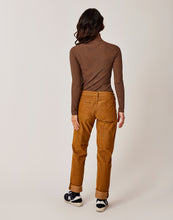 Back view of a Woman wearing the Brown corduroy Carson Cord pants, Carve Designs