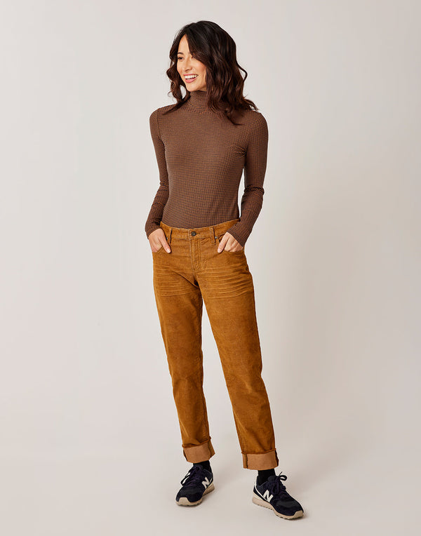 Front view of a women wearing the Brown corduroy Carson Cord pants, Carve Designs